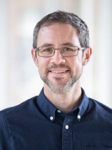 Man with glasses.